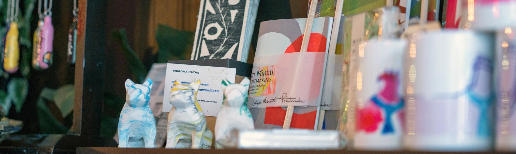 Shelf of a homeware store with items for sale