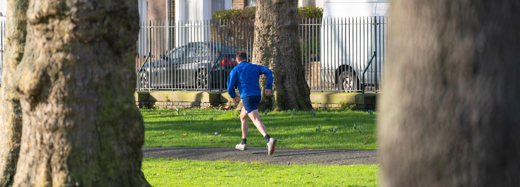Man running through park